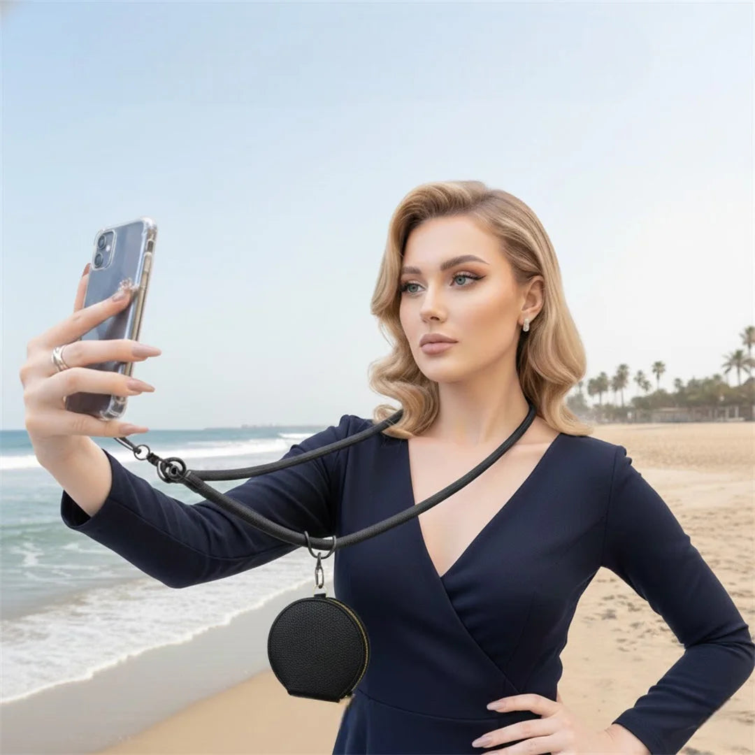Woman taking a selfie on a beach using a phone holder