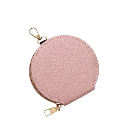 Pink round pouch with gold zipper and clasp on a white background