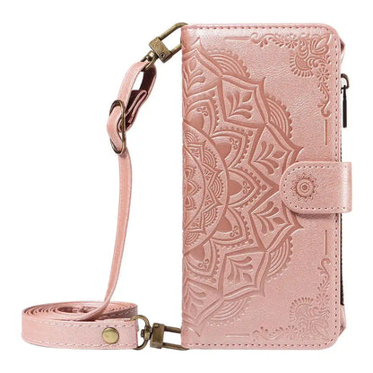 Pink wallet phone case with mandala design and detachable strap on a white background