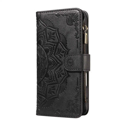 Black wallet phone case with intricate floral design on a white background