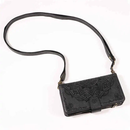 Black leather crossbody wallet phone case with intricate embossed design on a white background