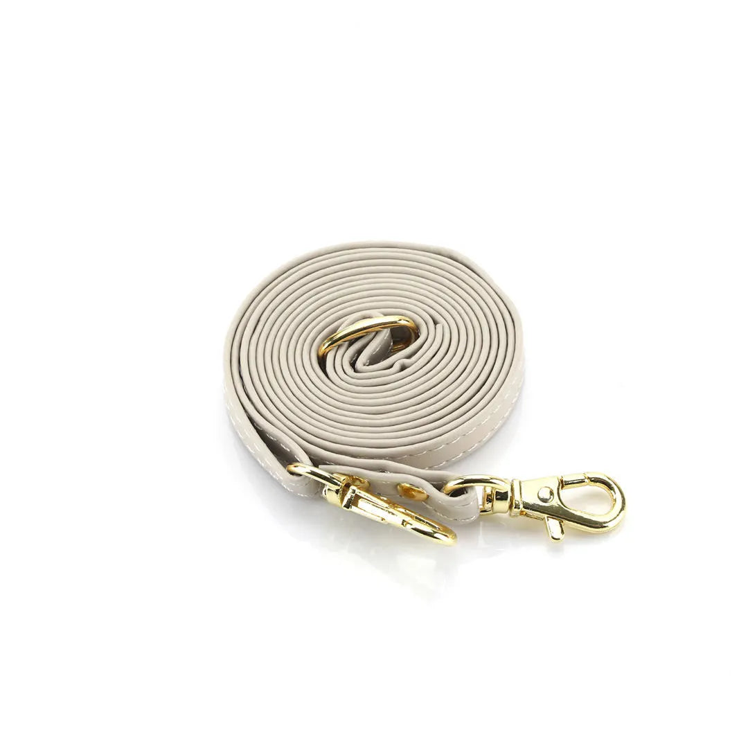 Beige crossbody lanyard with gold clasp on a white background