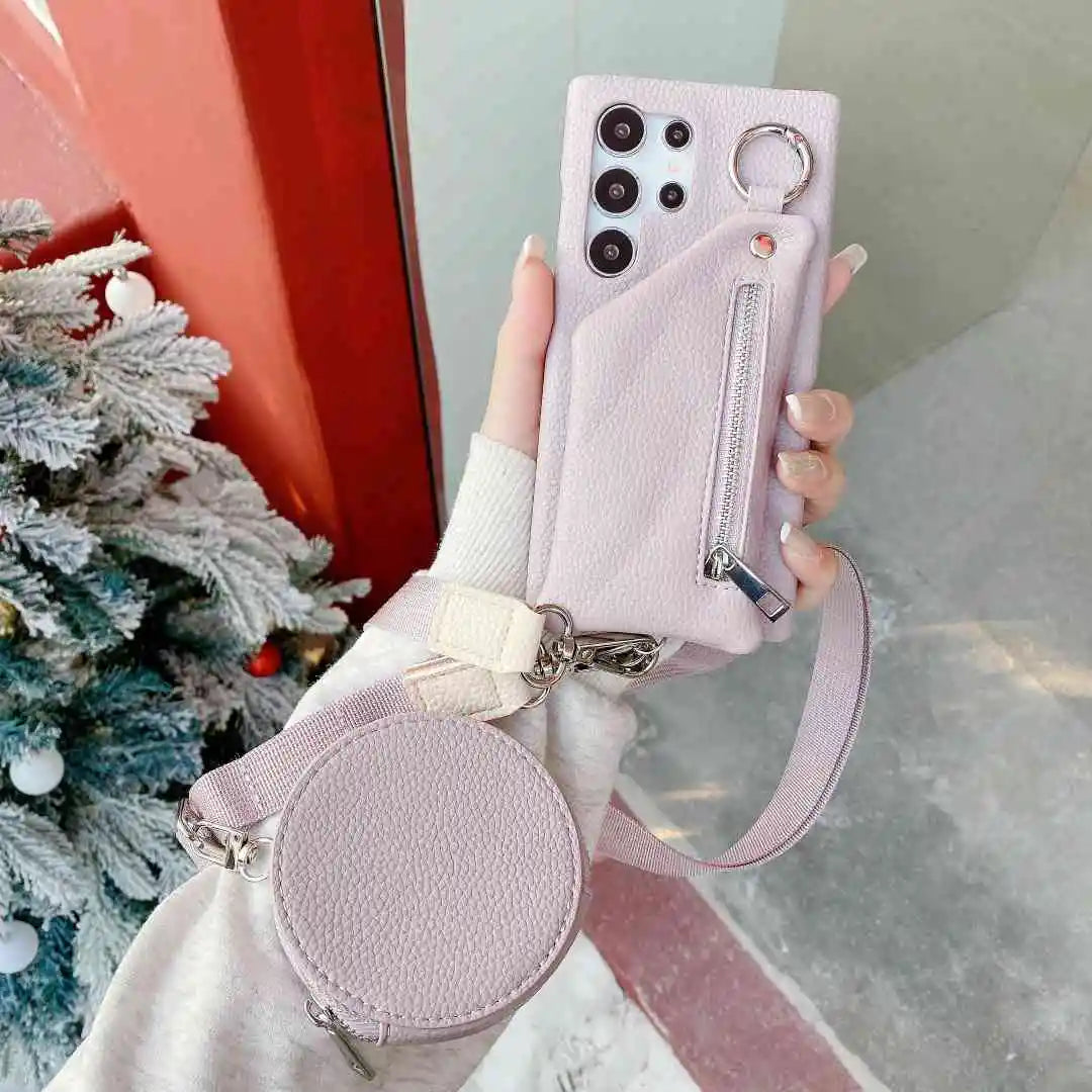 purple phone case with matching pouch held by a hand in front of a Christmas tree.