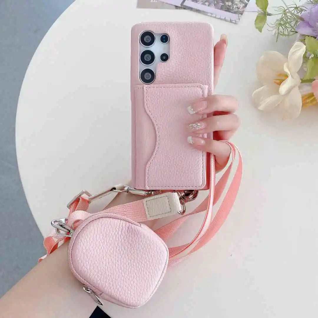 Pink Samsung wallet phone case with matching pouch held by a hand on a light background