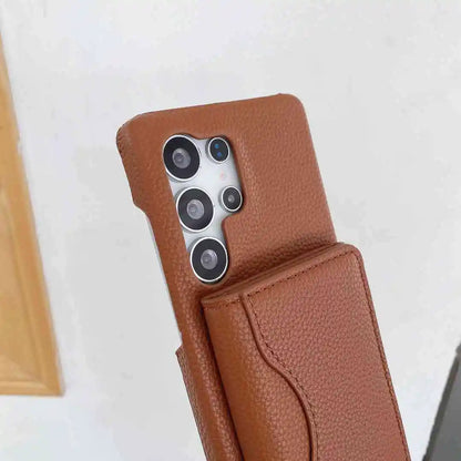 Brown wallet phone case with a Galaxy phone inside on a white background