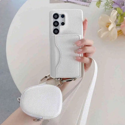 White samsung wallet phone case with a small pouch and crossbody strap on a white surface