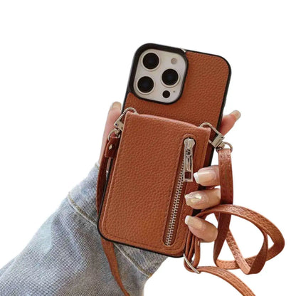 Brown wallet phone case with a zipper pocket and strap held by a hand on a white background