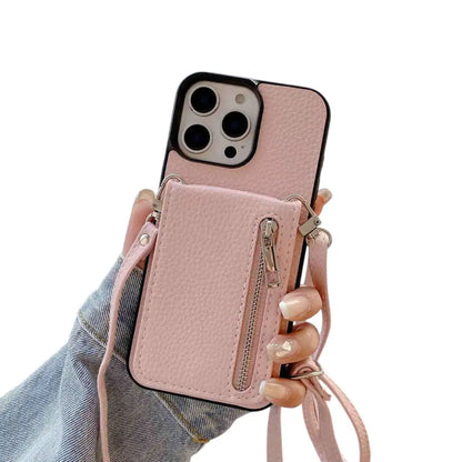 Pink wallet phone case with card holder and strap held by a hand on a white background