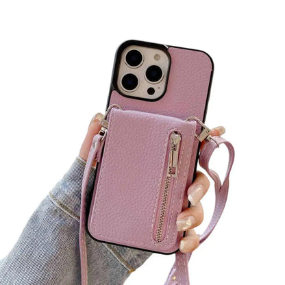 pruple wallet phone case with a detachable strap held by a person wearing jeans.
