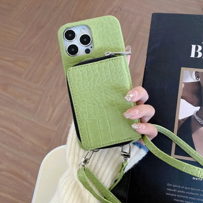 Lime Green phone case with a strap held by a hand on a wooden surface