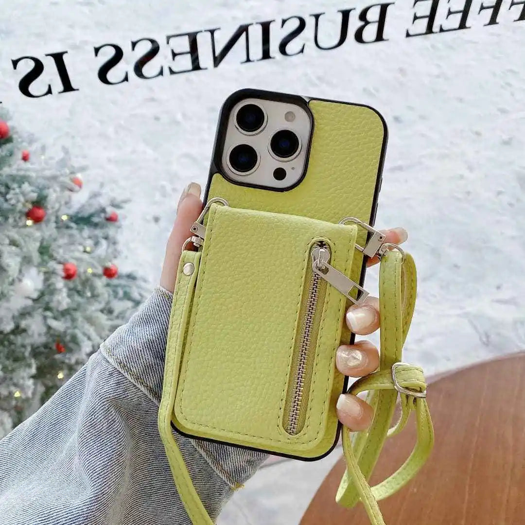 Limge green phone case with card holder and strap held by a hand, Christmas tree in the background