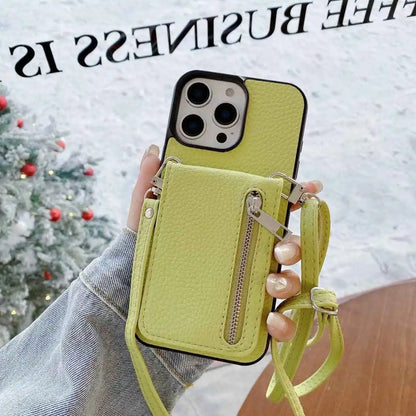 Limge green phone case with card holder and strap held by a hand, Christmas tree in the background