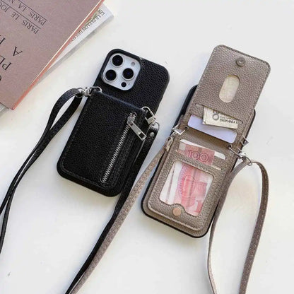 Two flip wallet phone cases with crossbody straps on a white surface