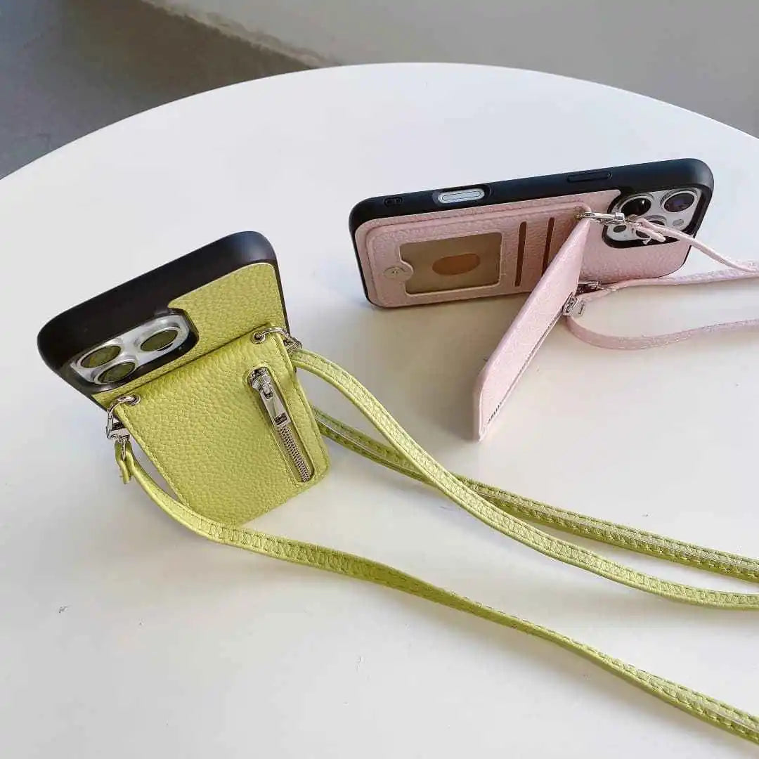 Two phone cases with straps on a white surface