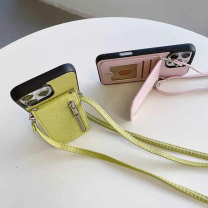 Two phone cases with straps on a white surface