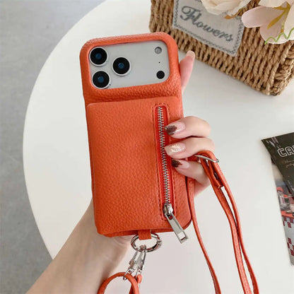 Orange crossbody phone case with a zipper wallet and strap held by a hand on a white surface.
