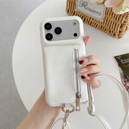 White phone case with zipper wallet and strap held by a hand on a light gray background