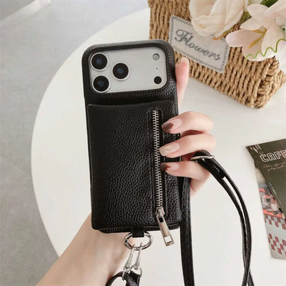 Black phone case with zipper wallet pocket held by a hand on a light surface.