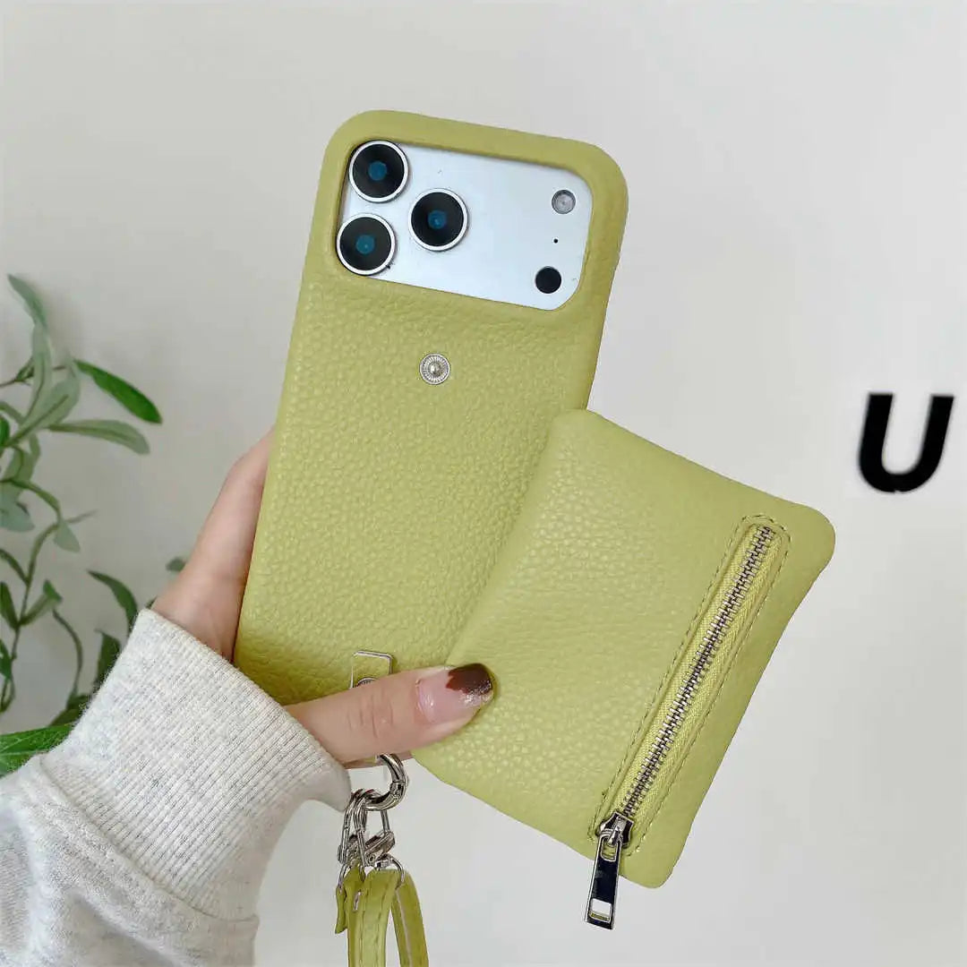 Green phone case with a zipper wallet held by a hand against a neutral background