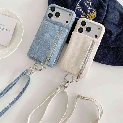Two wallet phone cases with cross body straps on a white surface