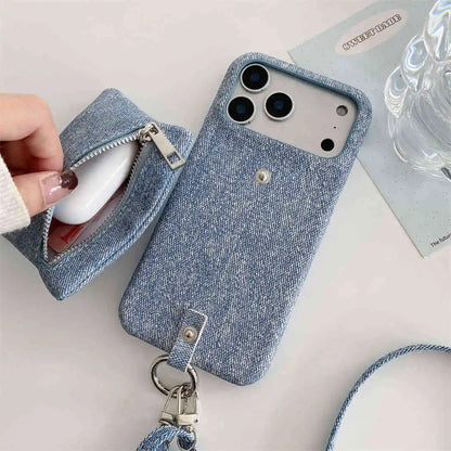 Blue denim phone case with a detachable wallet on a light surface