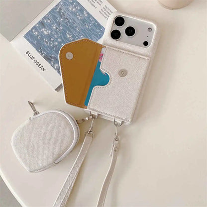 Phone case with detachable pouch and crossbody strap on a light surface
