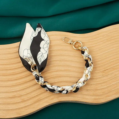 white flower scalf chain wristlet