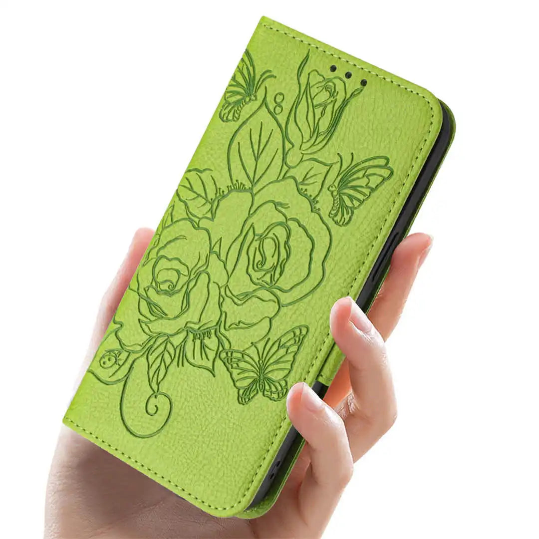 Green wallet folio phone case with floral design held by a hand on a white background