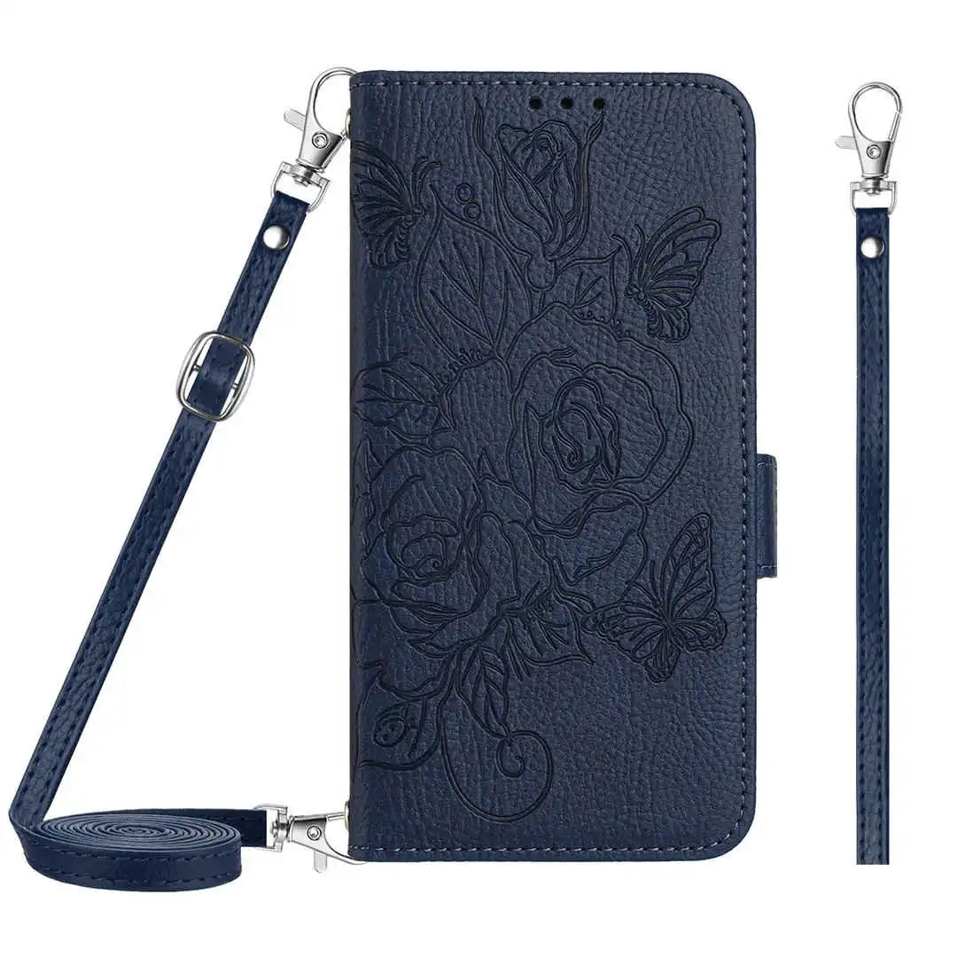 Navy blue folio wallet phone case with floral design and detachable strap on a white background
