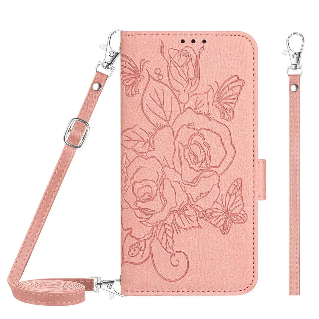 Pink folio wallet phone case with floral design and strap on a white background