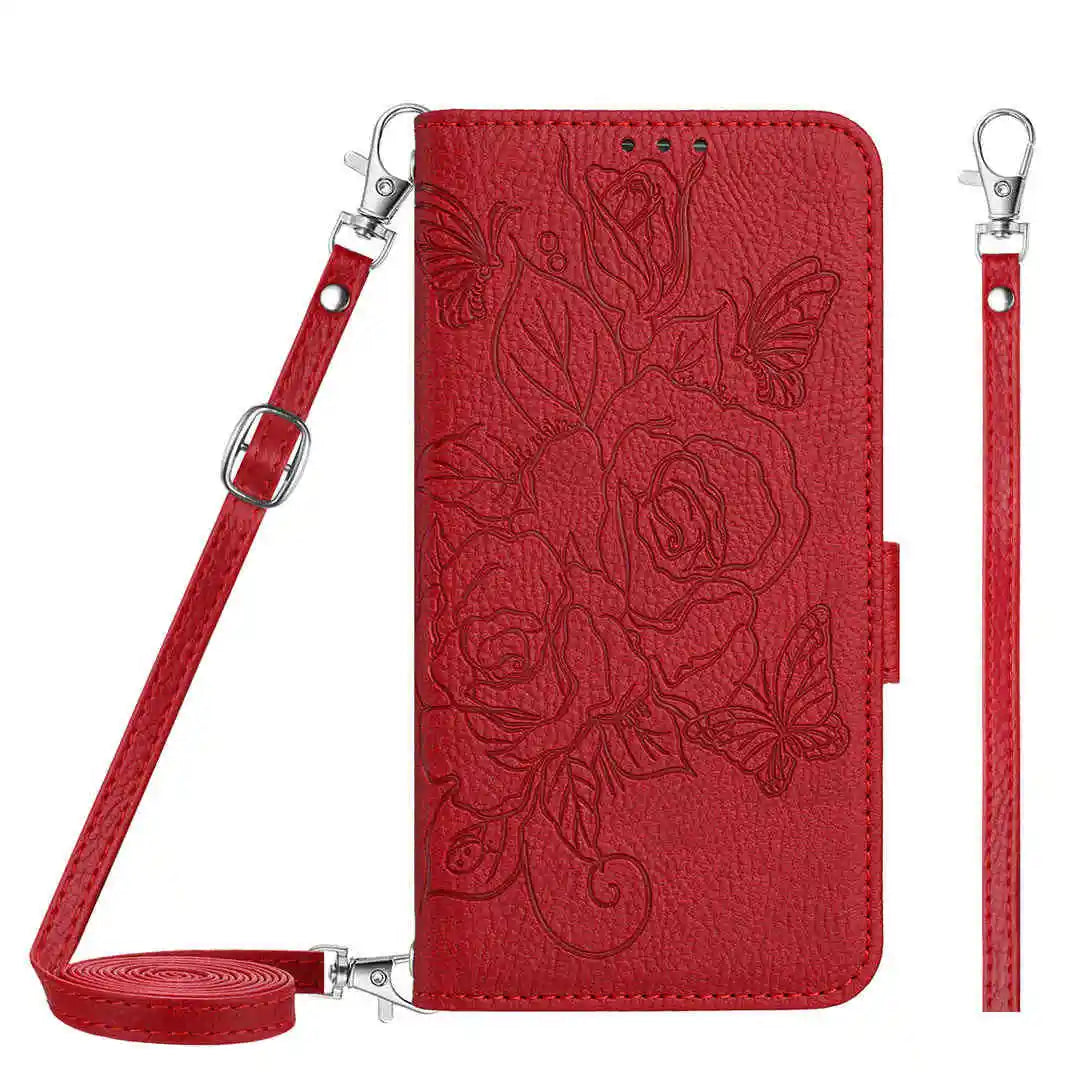 Red folio wallet phone case with floral design and detachable strap on a white background