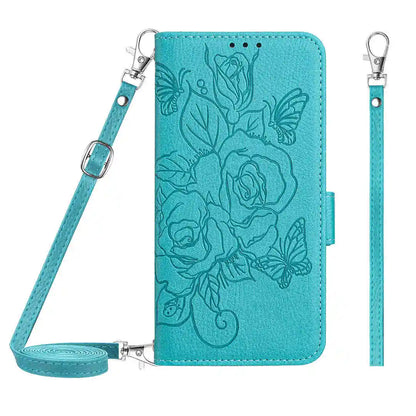 Teal folio wallet phone case with floral design and strap on a white background