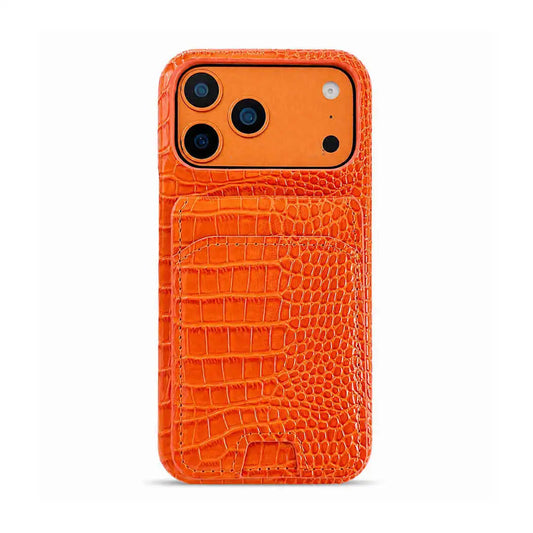 An orange phone case with a crocodile-embossed texture, featuring a built-in card pocket on the back and precise cutouts for a triple-camera system, shown on a plain white background.