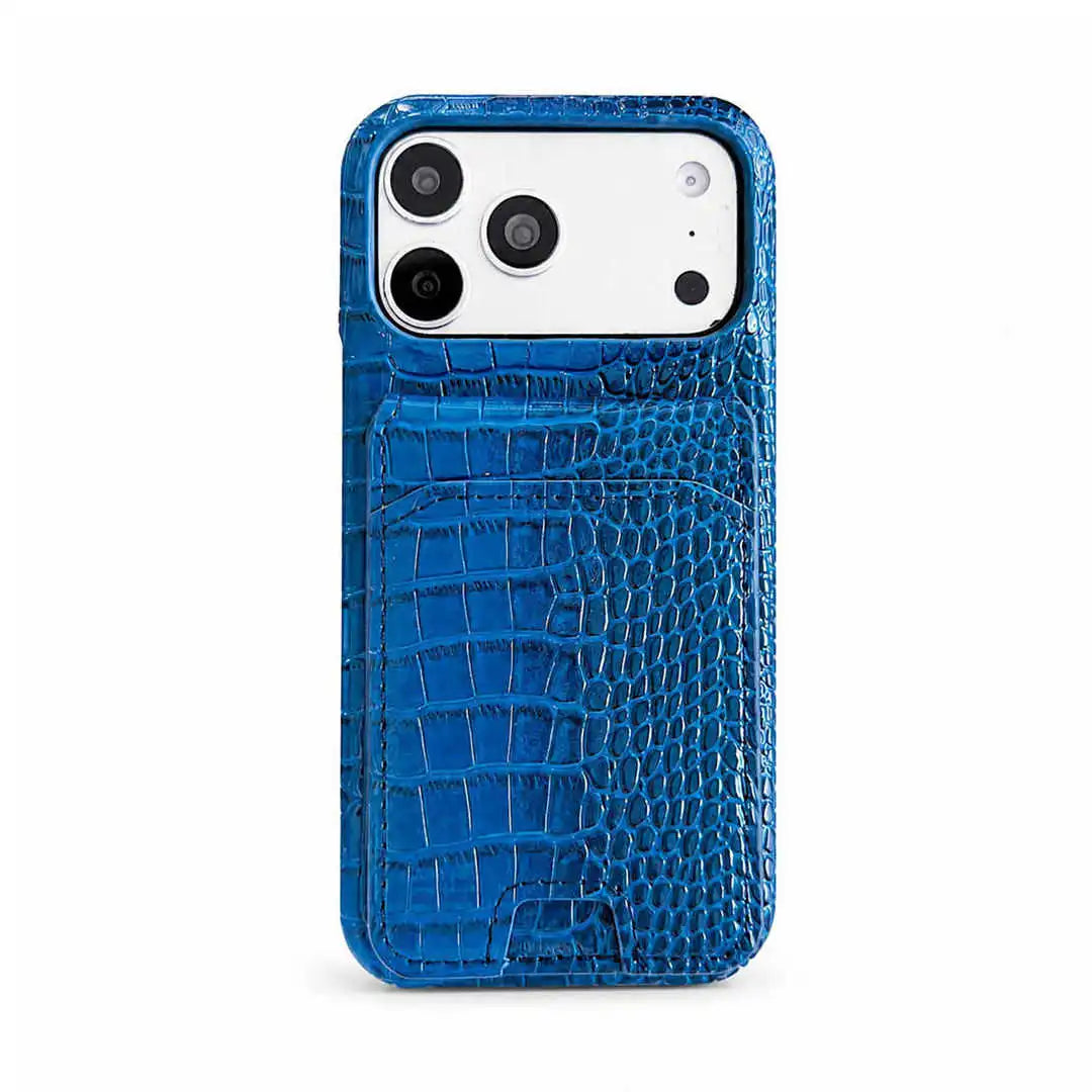 A blue crocodile-embossed phone case with a built-in card pocket, shown on a white smartphone against a clean white background.