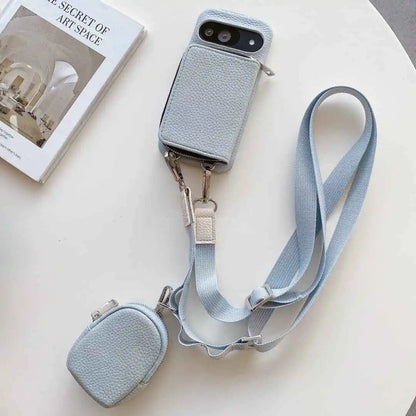 Dusty blue phone case with detachable strap and pouch on a white surface