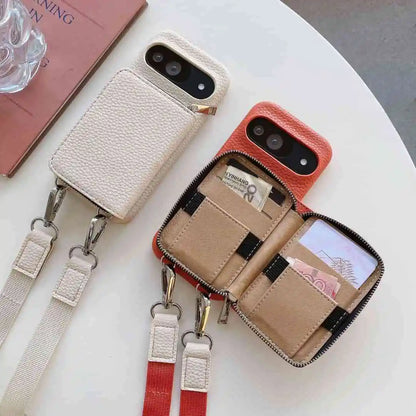 Phone case with wallet and strap on a white surface