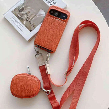 Orange wallet phone case for Pixel with a matching pouch and red strap on a light background