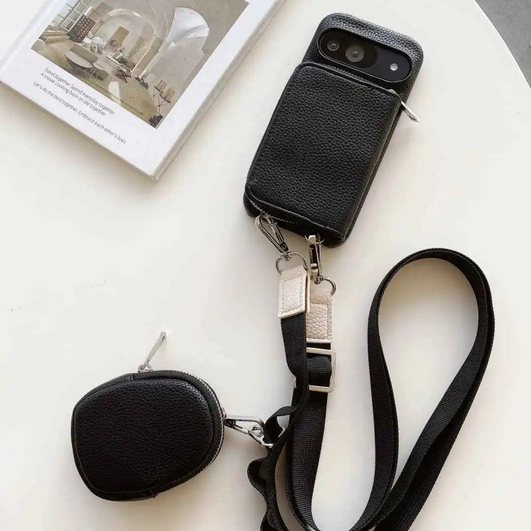 Black wallet phone case for Google Pixel with attached strap and pouch on a white surface