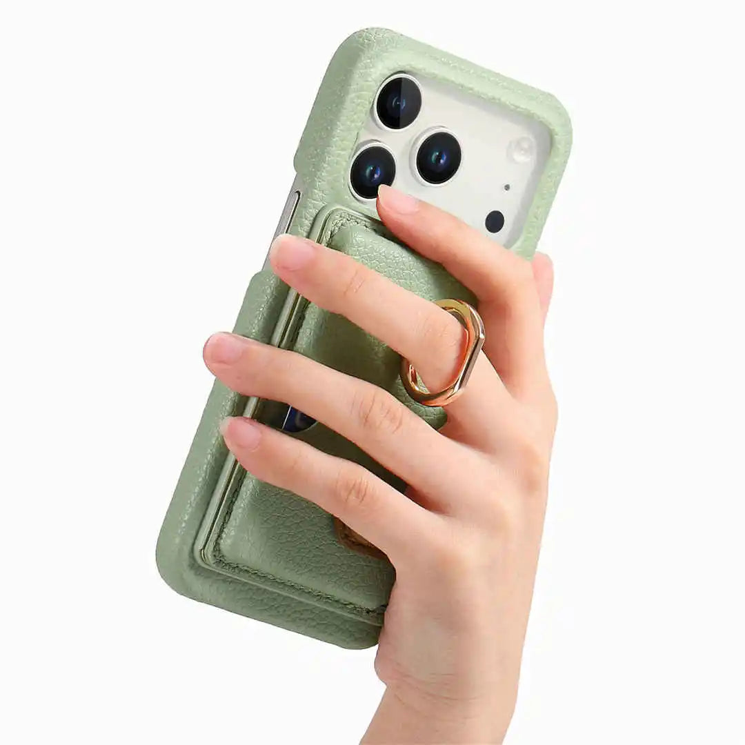 Hand holding a green phone case with a ring holder on a white background
