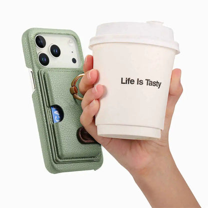 Hand holding a phone case with cup holder and a 'Life Is Tasty' coffee cup.
