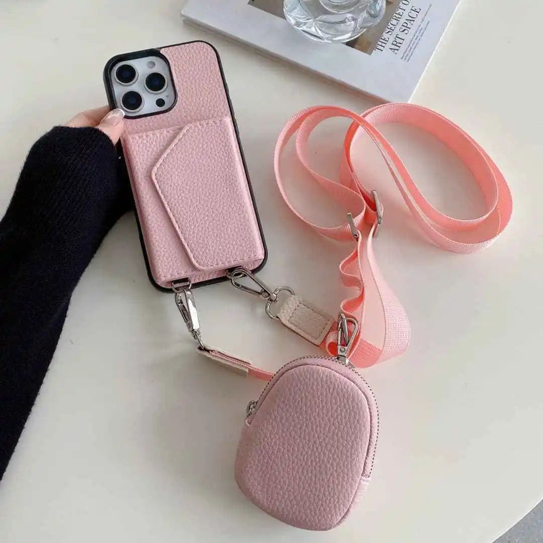 Pink wallet phone case with detachable pouch and strap on a white surface