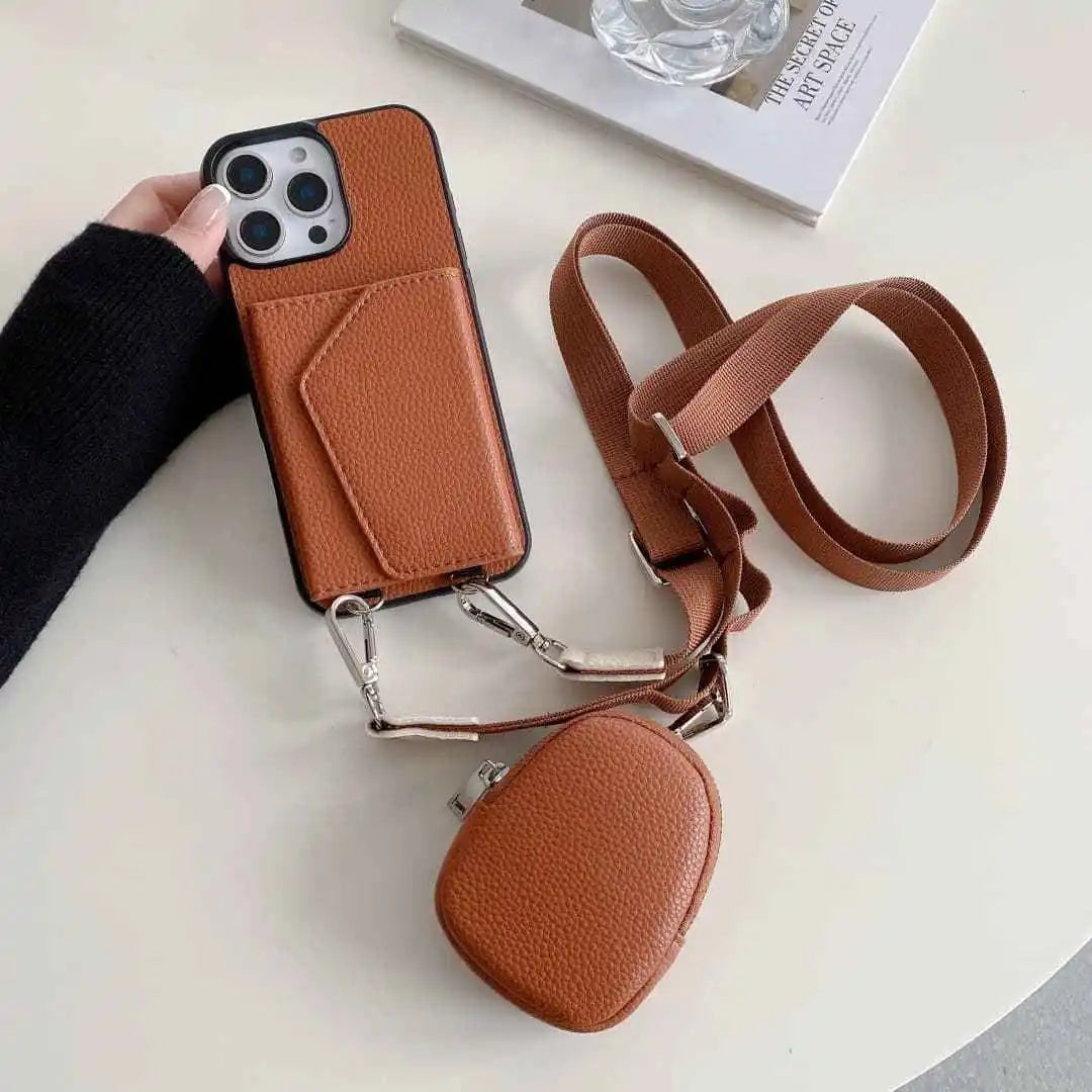 Brown wallet phone case with strap and card holder on a white surface