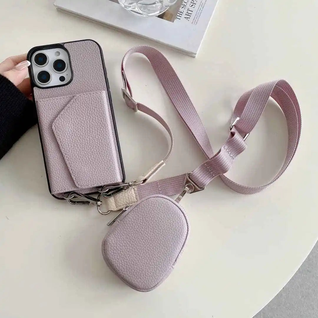 Dusty lavender wallet phone case with a matching pouch and strap on a light surface.