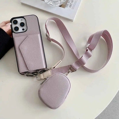 Dusty lavender wallet phone case with a matching pouch and strap on a light surface.