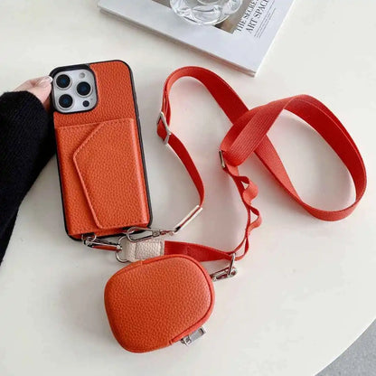 Orange wallet phone case with a matching pouch and red strap on a white surface.