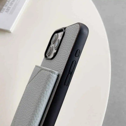 Phone case with textured gray interior and black exterior on a light gray background
