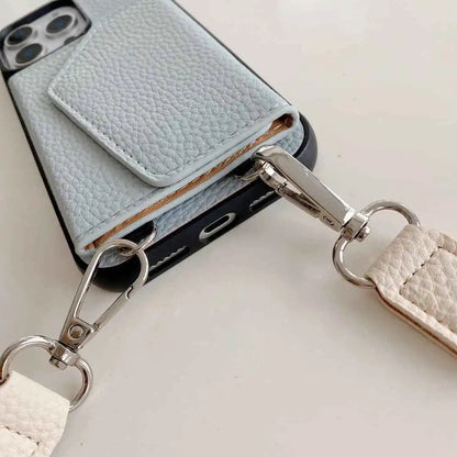 wallet Phone case with a detachable strap on a light background