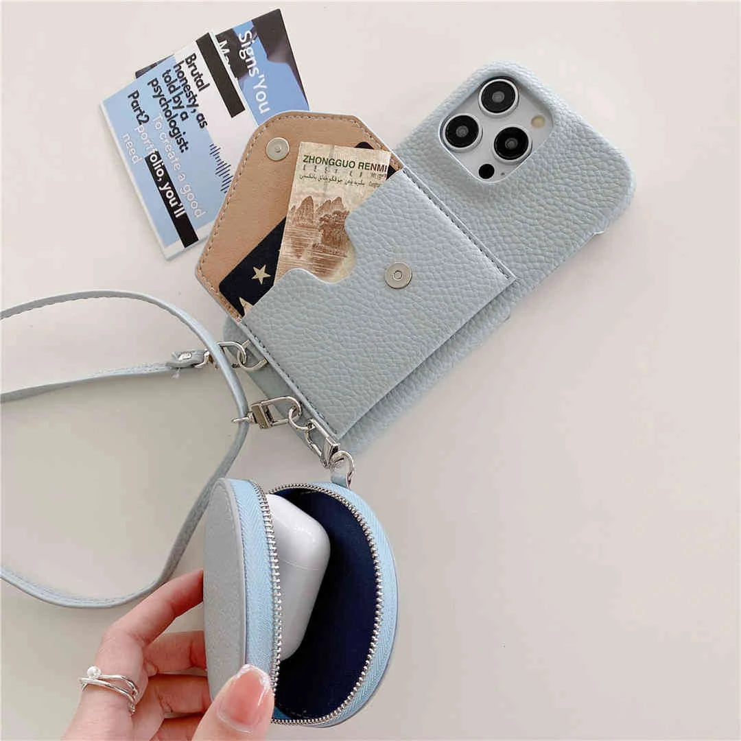 Light blue phone case with card slots and a small pouch, held by a hand.
