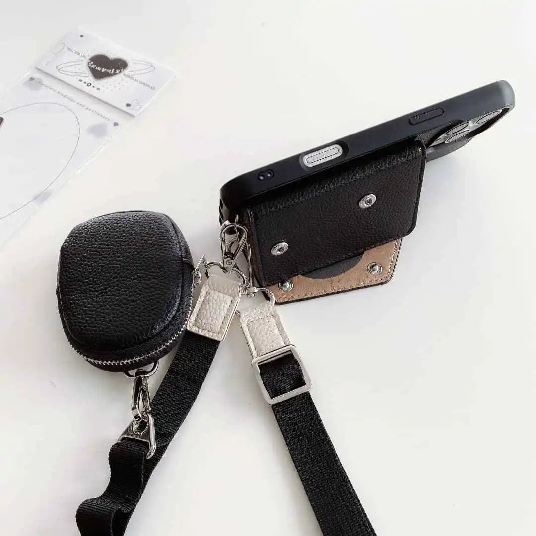 Black wallet phone case with attached strap and black pouch on a white background