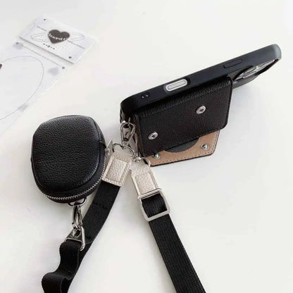 Black wallet phone case with attached strap and black pouch on a white background